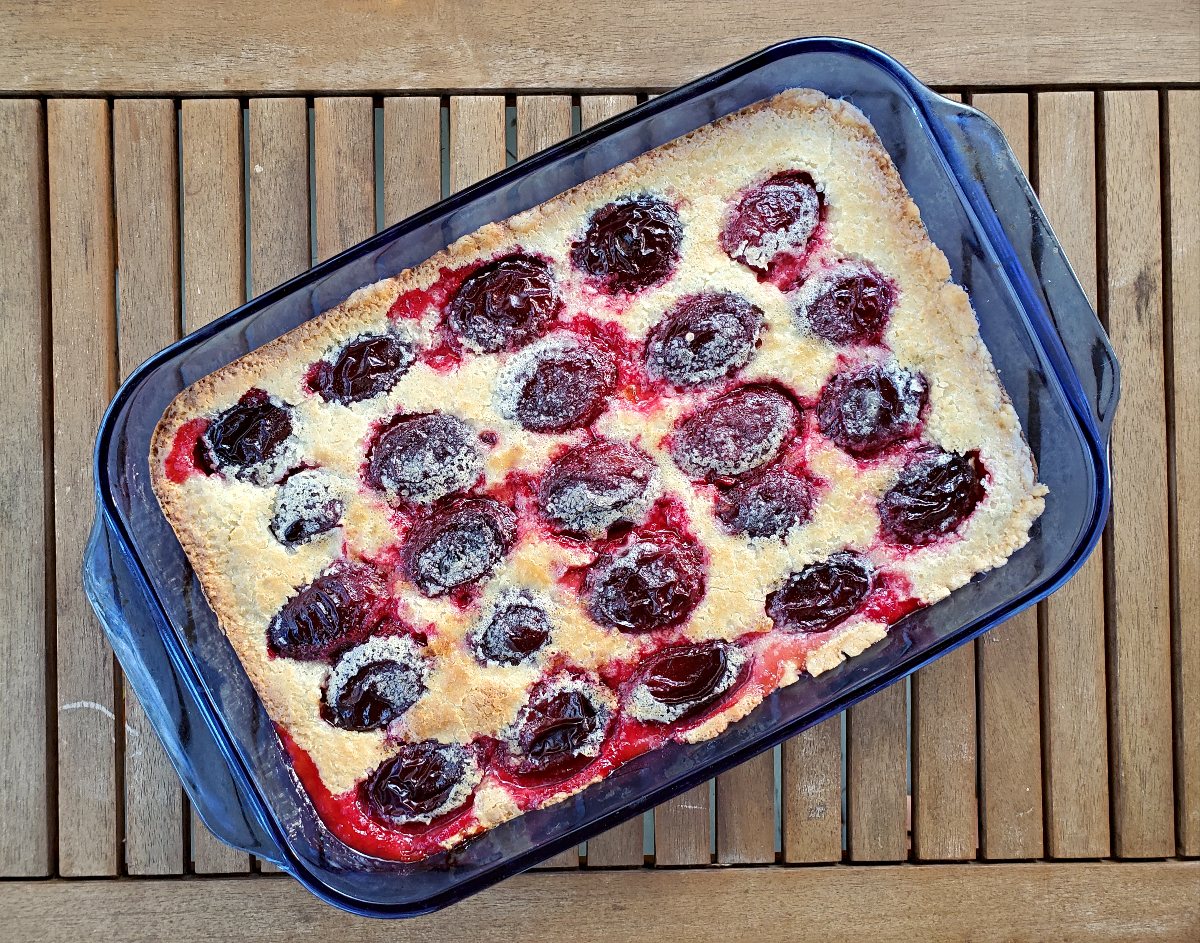 https://honestandtruly.com/german-plum-kuchen-recipe/overhead-shot-of-a-pan-of-plum-kuchen/