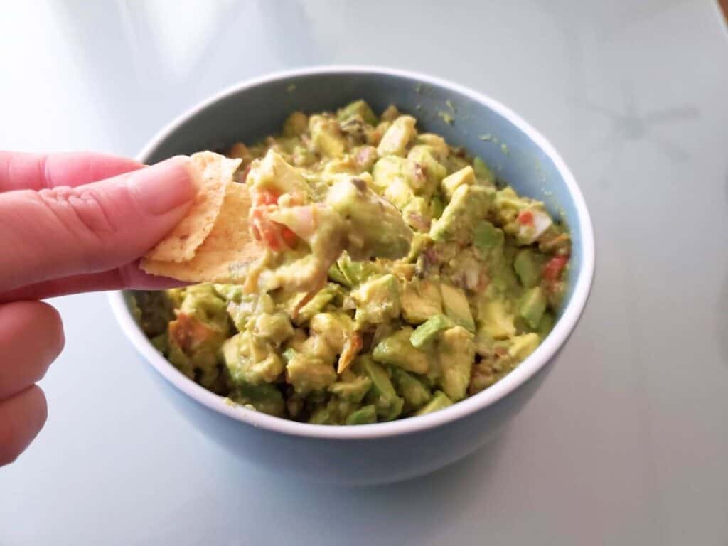 Image shows chip with a bit of guacamole.