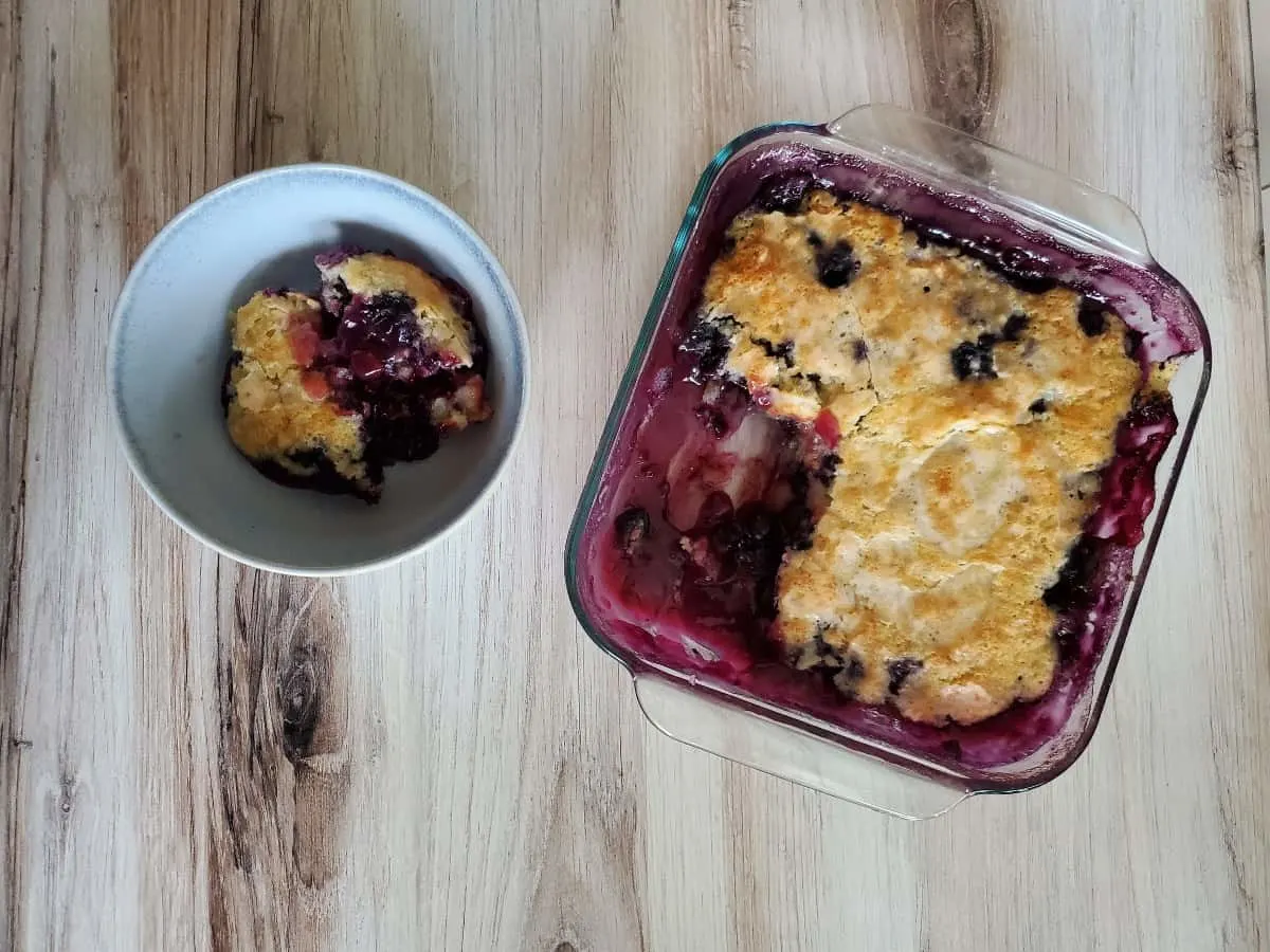 Overhead shot of a serving of pudding cake and the pan.