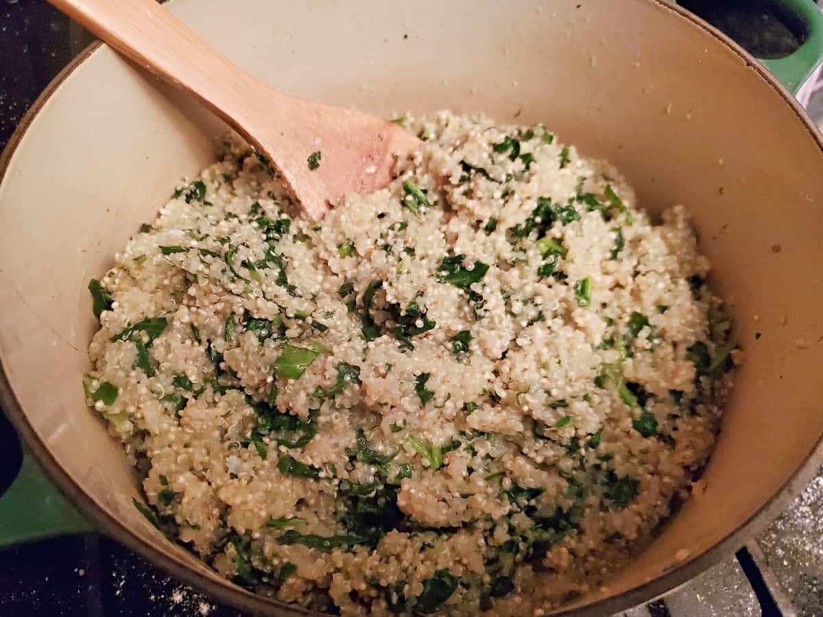 Spinach leaves now wilted into spinach and parmesan quinoa pot.