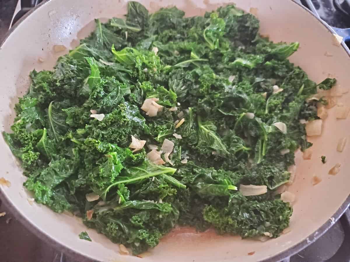 Garlic sesame kale in a pot just cooked and ready to eat.