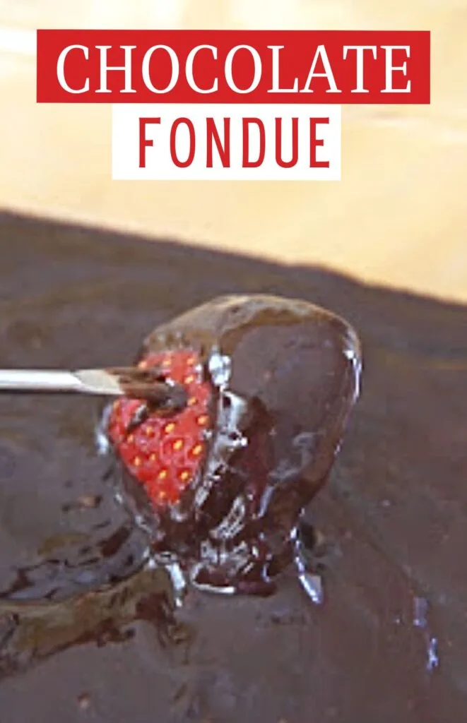 Strawberry being dipped into chocolate with text with text chocolate fondue.