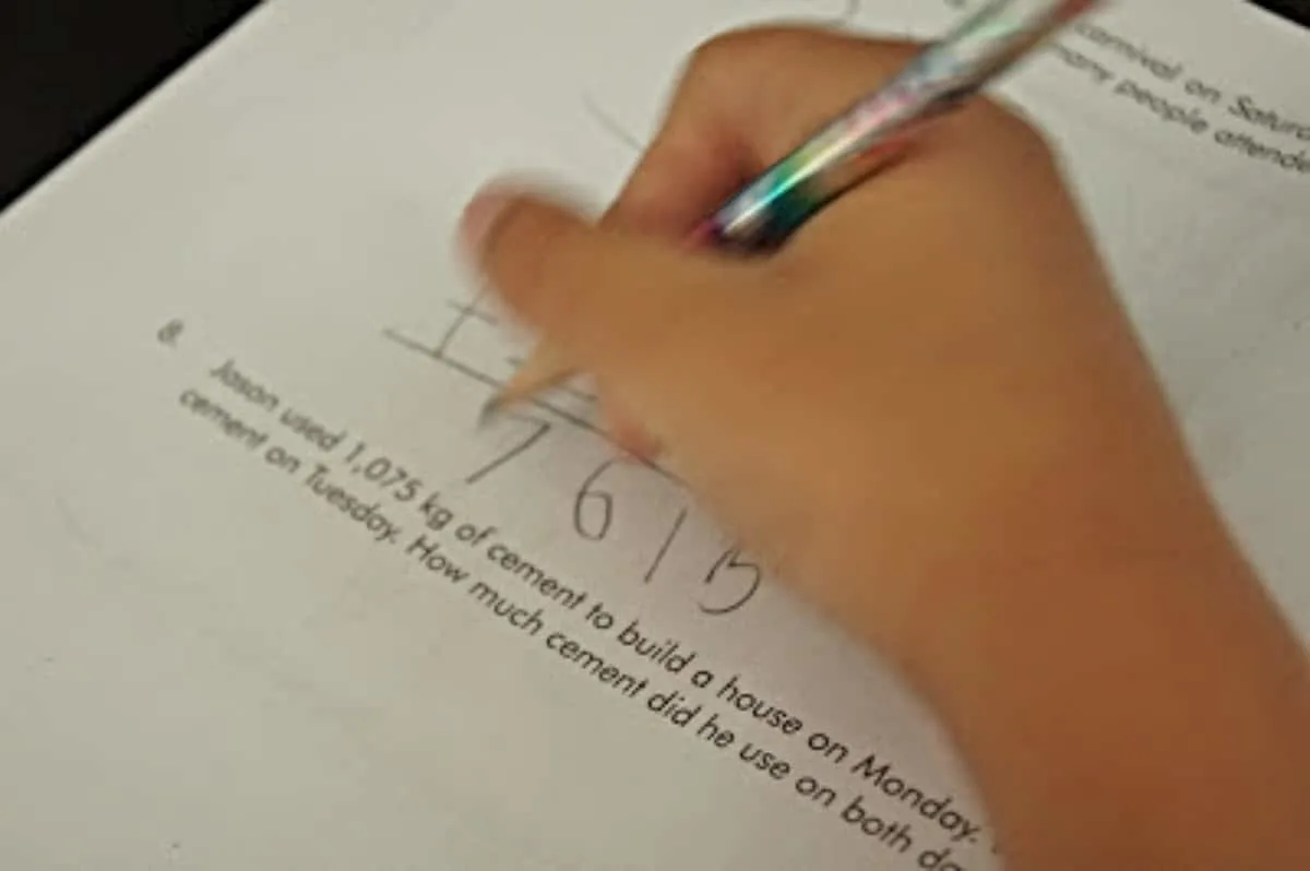 Child solving a math word problem.