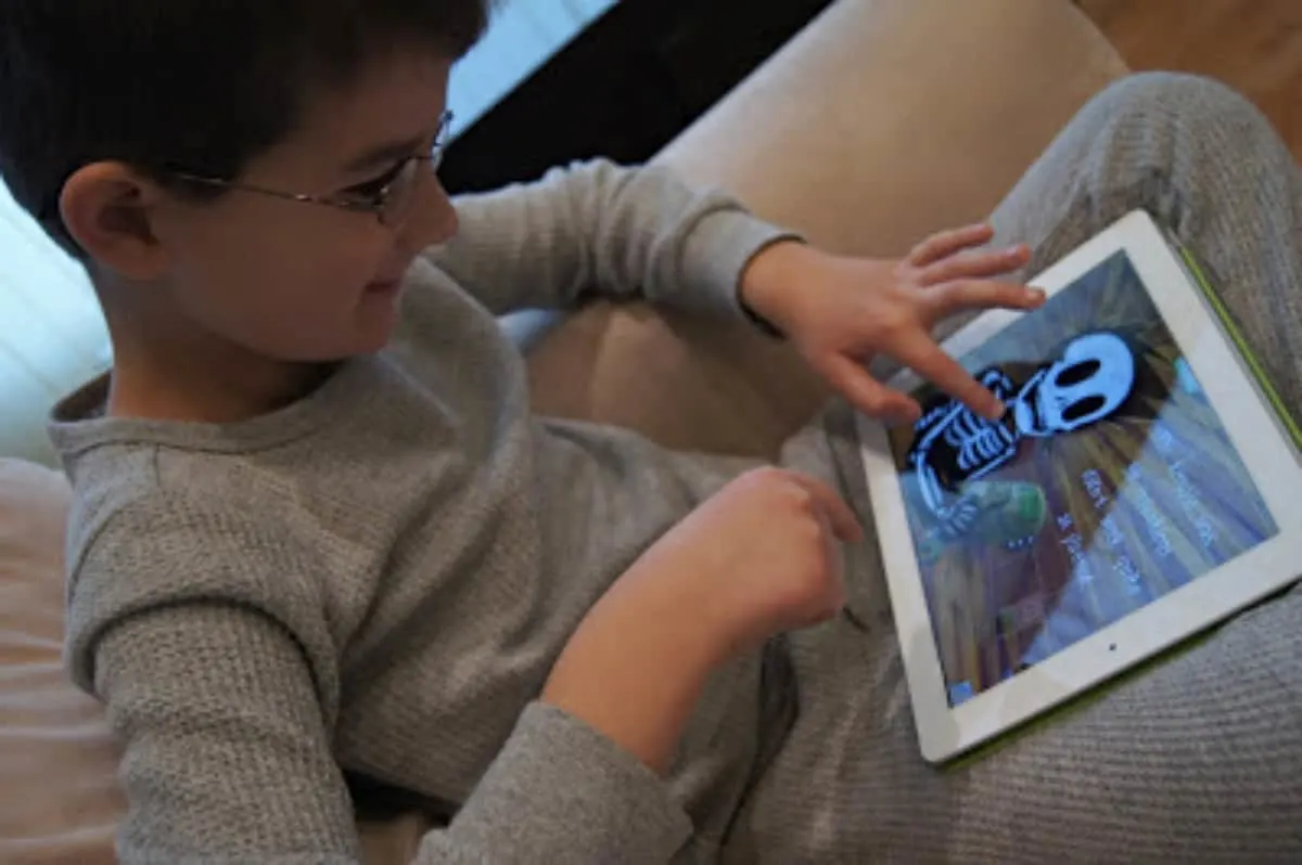 Boy playing with an iPad.