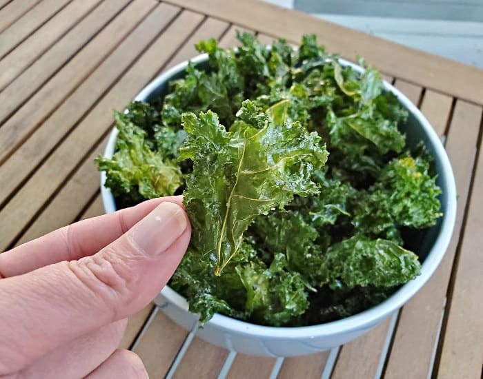 Picking up a homemade baked kale chip