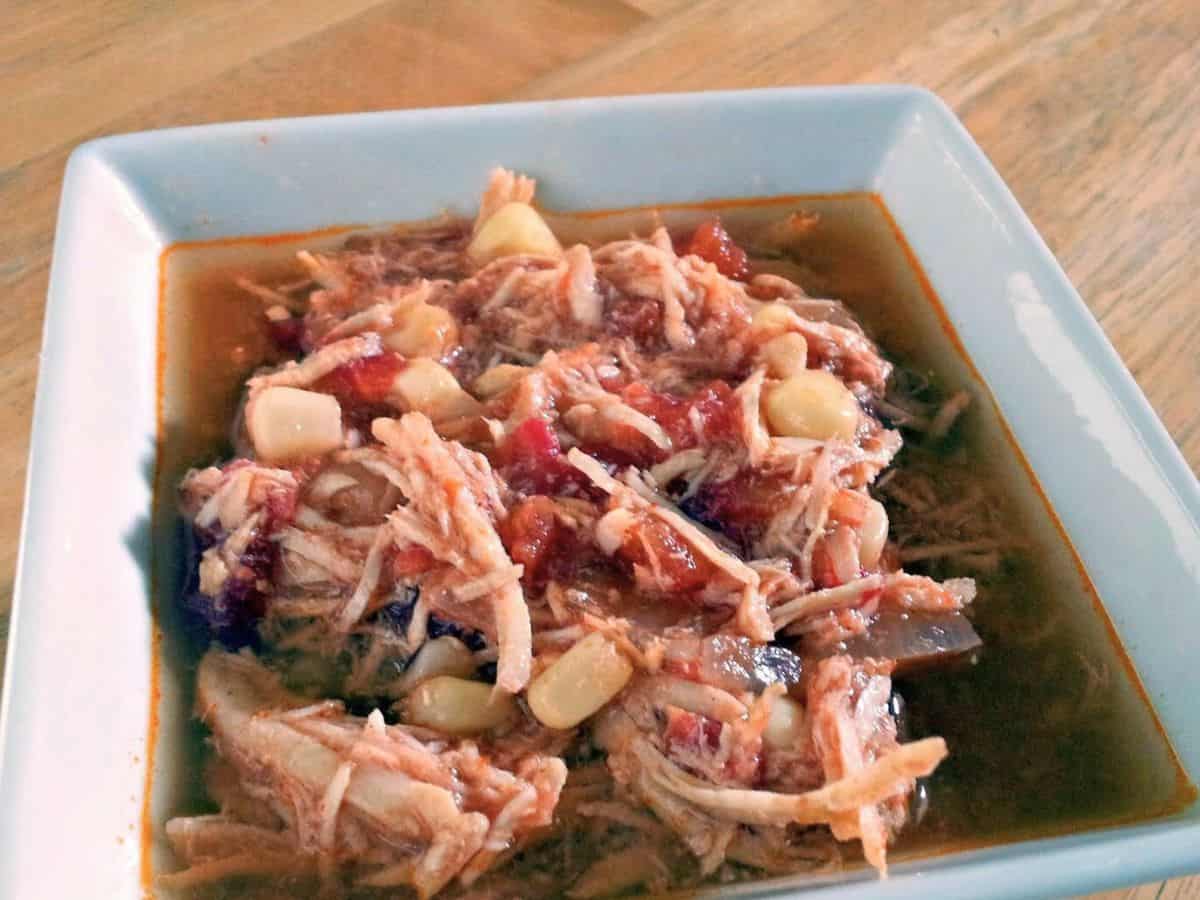 Image shows tortilla soup in a bowl.