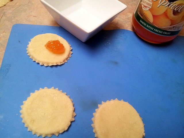 Apricot cookies getting the preserves added