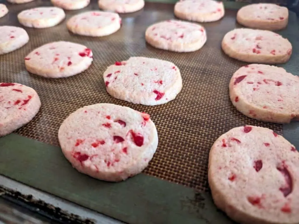 Image shows close-up of cherry sugar cookies.