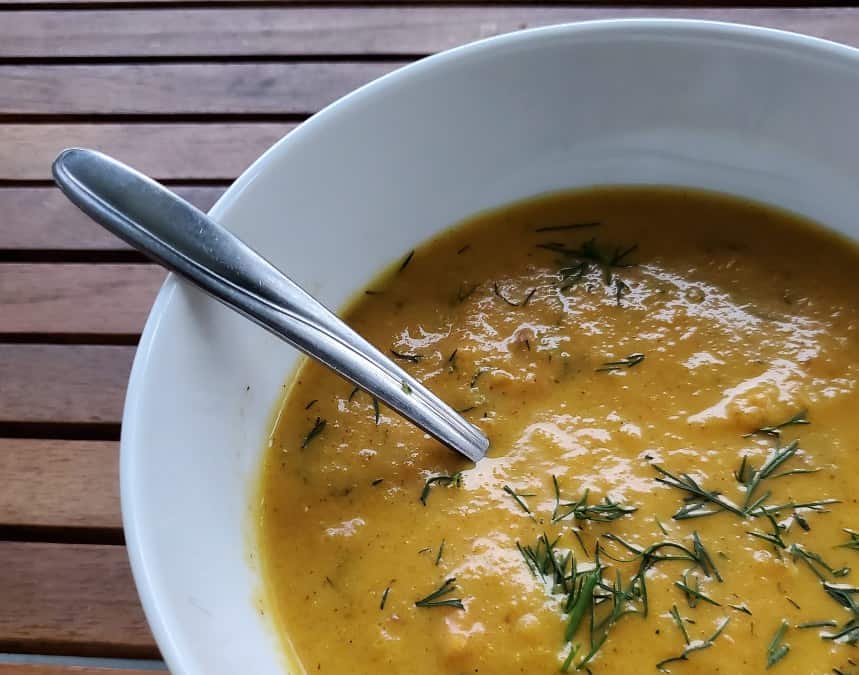 Closeup of carrot ginger soup with dill