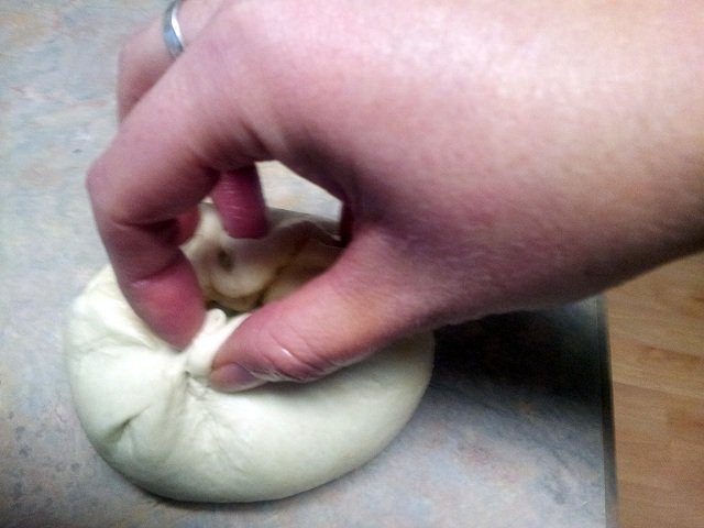 Use your fingers to pinch the bottom of your bread bowl together