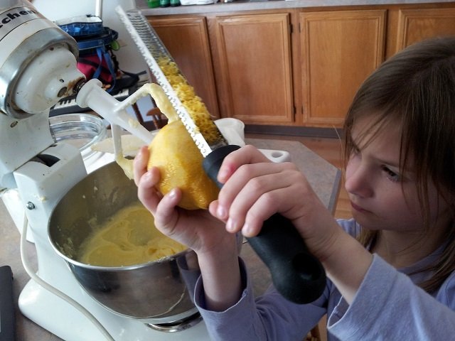 Seven year old zesting a lemon