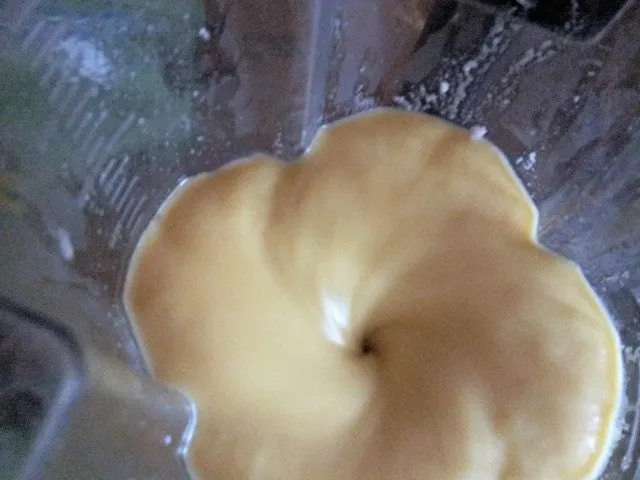 Blending the mango frozen yogurt base