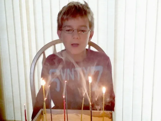 Mister Man blowing out birthday candles