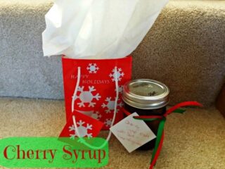 Cherry syrup in a jar with Christmas bag