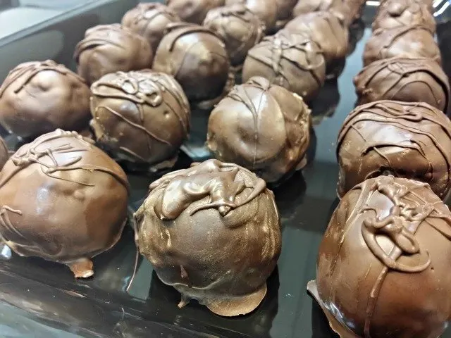 Chocolate chip cookie dough truffles on display