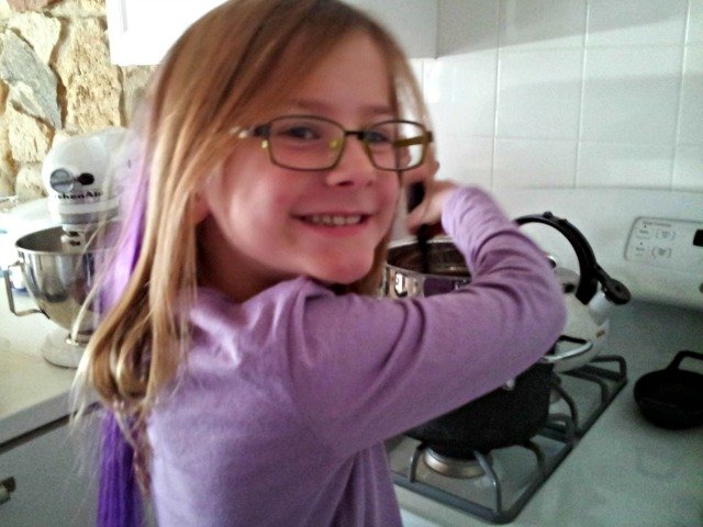 Little Miss helping to melt chocolate