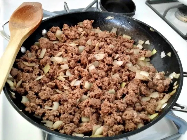 Fully browned ground beef is ready to be mixed with tomatoes