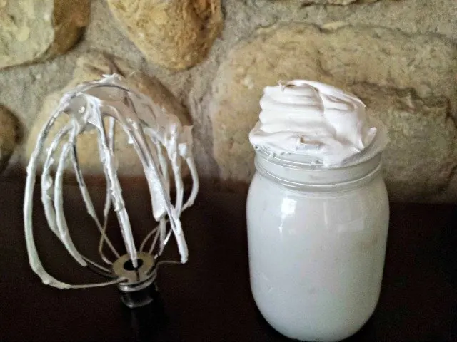 Homemade marshmallow fluff in a jar for storage