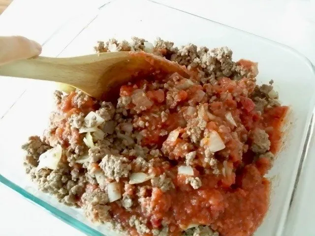 Add tomatoes to your ground beef mixture for Shepherd's Pie, and stir