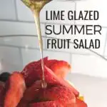 Image shows a Pot pouring lime glaze over fruit with text lime glazed summer fruit salad.