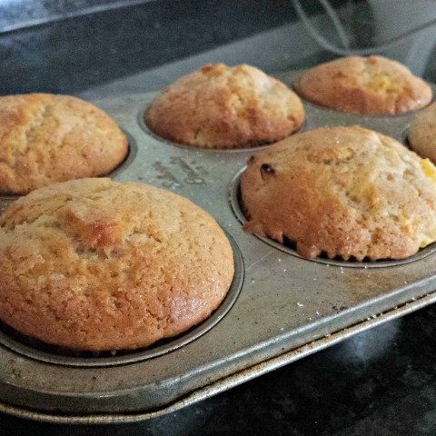 Perfectly baked peach kuchen muffins