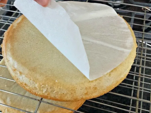 Turn cakes out onto cooling racks and remove the parchment paper