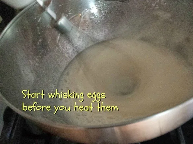 Whisk your egg mixture before heating for more fluffy frosting