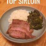 Blue plate with sliced steak and greens and rice and text marinated top sirloin.