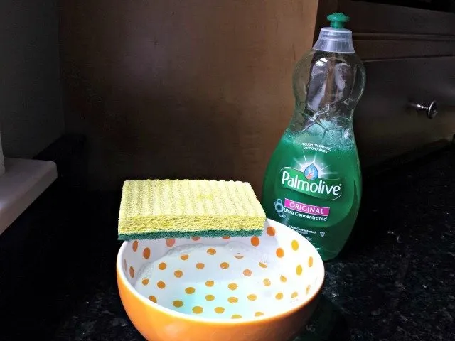 Steaming water with a little Palmolive removes soap scum