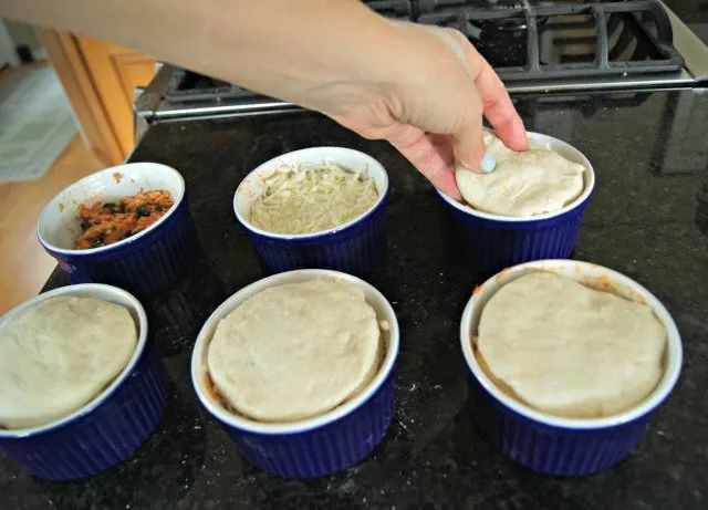 Adding biscuit dough is the last step before baking pizzakins