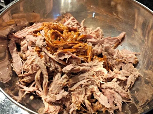 Mix pork and liquid together once the pork is shredded