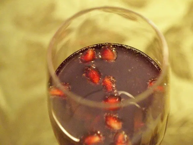 Pomegranate arils float in the fizz