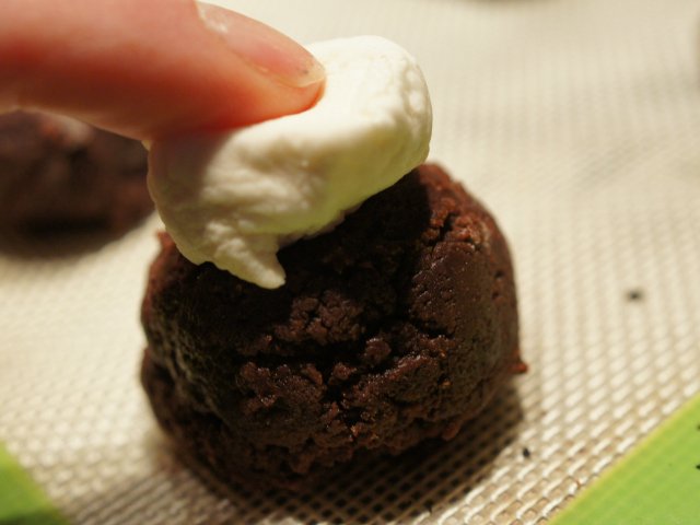 Hot chocolate cookies with marshmallow being added