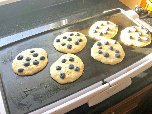 Blueberry pancakes cooking