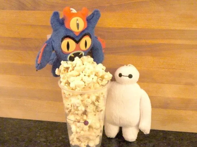 Fredzilla and Baymax posing with marshmallow pocorn