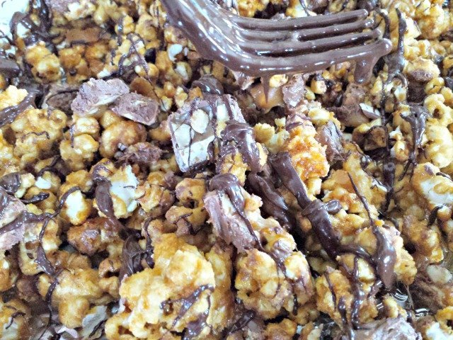 Drizzling snickers popcorn