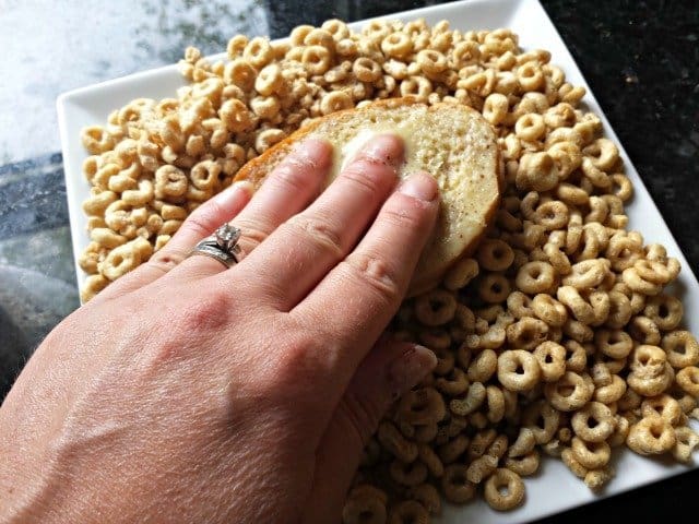 Gently press bread into cereal