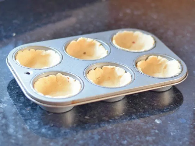 Push masa into a muffin tin