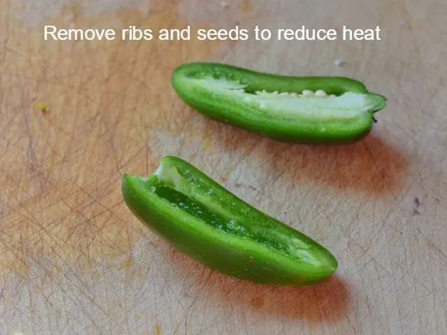 Remove ribs and seeds from jalpenos