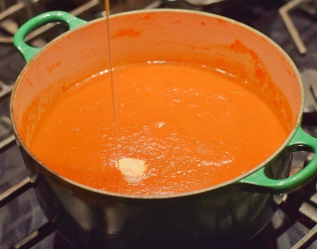 Add cream to tomato basil bisque