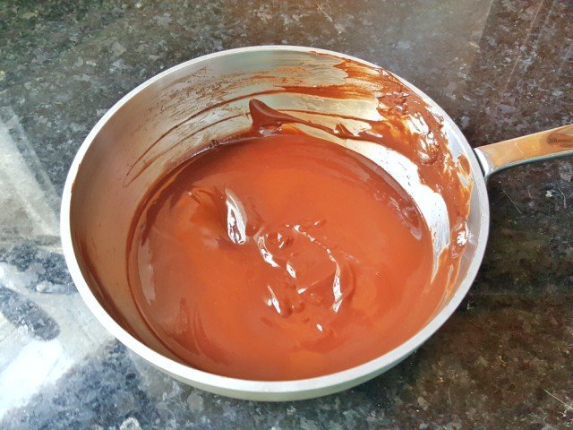 Chocolate frosting ready for dipping
