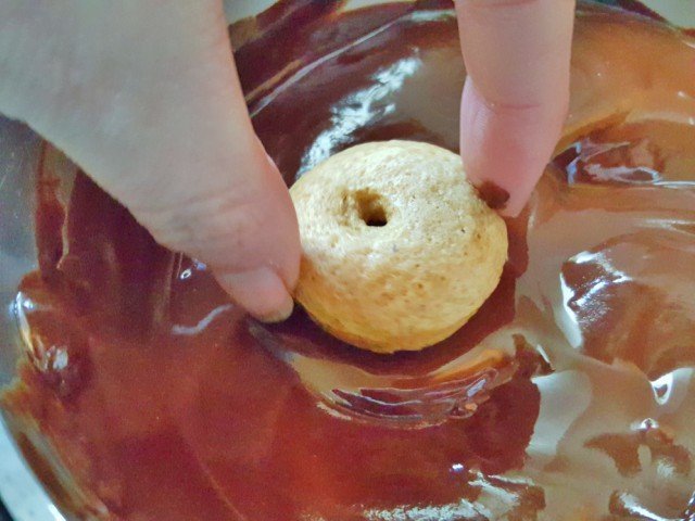 Dip donut baked side down and twist then pull