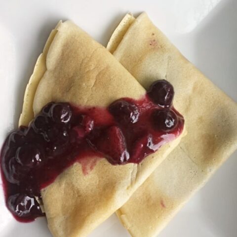 Blueberry syrup on crepes