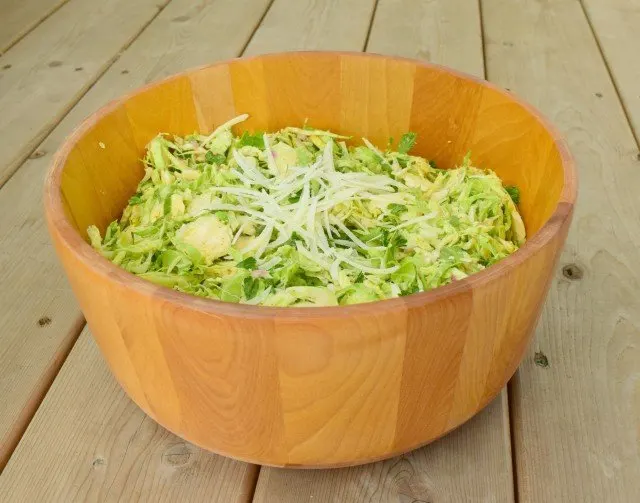 Bowl of shaved Brussels Sprouts salad with Parmesan