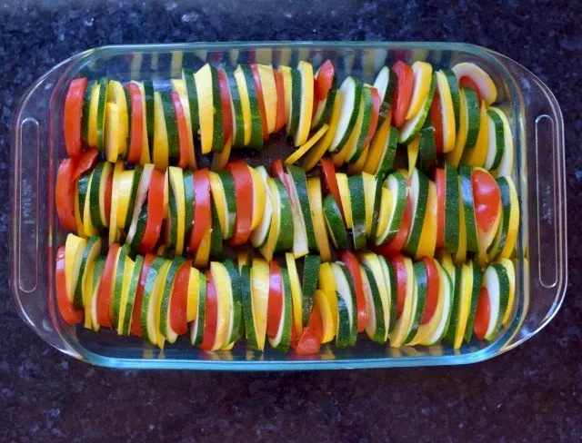 Layer veggies in baking dish for Italian Roasted Vegetables