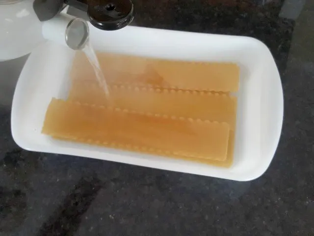 Pour boiling water over lasanga noodles
