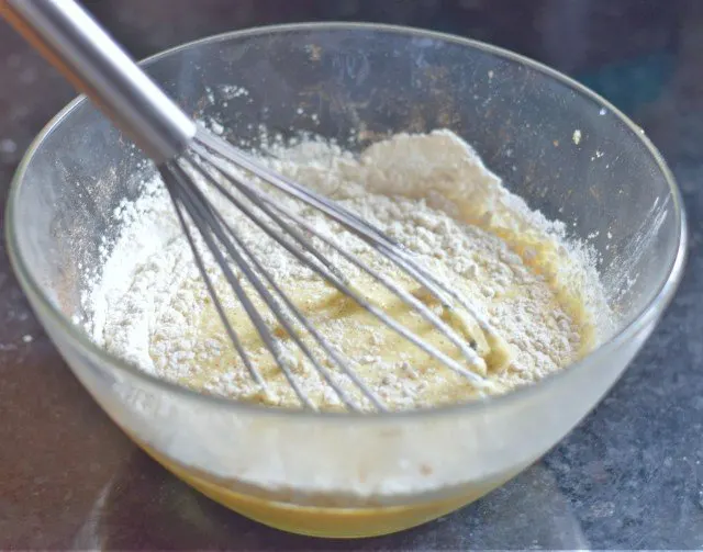 Whisk flour into eggs and milk