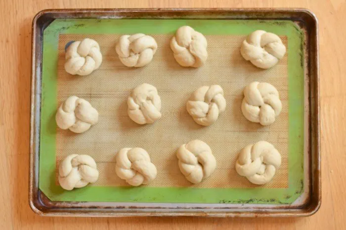 Add homemade dinner rolls dough to baking sheet