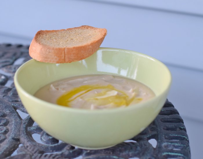 Bowl of gluten free Tuscan bean soup with crostini