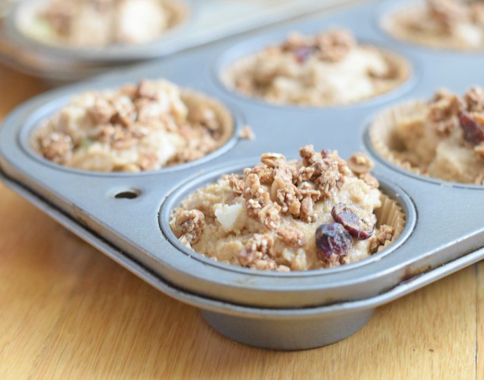 Apple cinnamon muffins studded with granola ready to bake